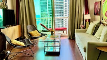 Luxury Condo | Living area | Flat-screen TV, toys