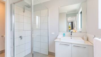 Shower, hair dryer, towels, soap