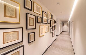 Stylish hallway with framed documents and a clean, minimalist design.