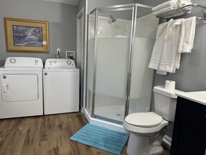 Shower, hair dryer, towels, soap
