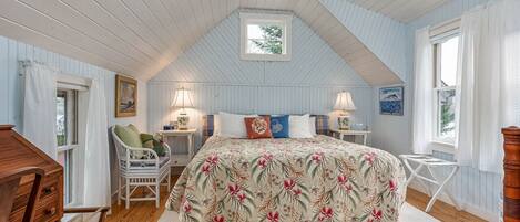 Second floor bedroom with king-sized bed and clothing storage