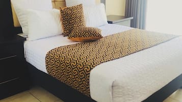 Deluxe Suite | Living area | 50-inch LED TV with satellite channels