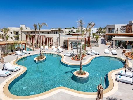 Seasonal outdoor pool, pool umbrellas, pool loungers. Noble Hotel Suites - Adults Only