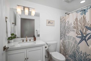 Shower, hair dryer, towels, shampoo