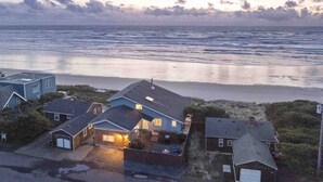 A coastal residential area with houses overlooking the beach. - Unreal Panoramic Oceanfront and Beach Views, Hot Tub, New Game Room, Fire-table, 1/2 Mile to Town (Rockaway Beach)