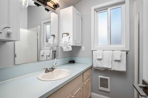 Shower, hair dryer, towels, shampoo