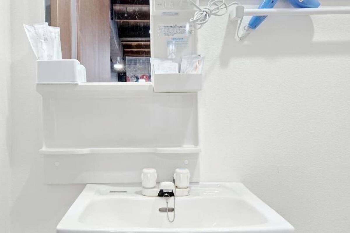 Bathroom | Hair dryer, slippers, bidet, towels
