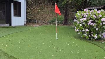 Enjoy a round of golf on this meticulously maintained course surrounded by lush vegetation and a picturesque backdrop.