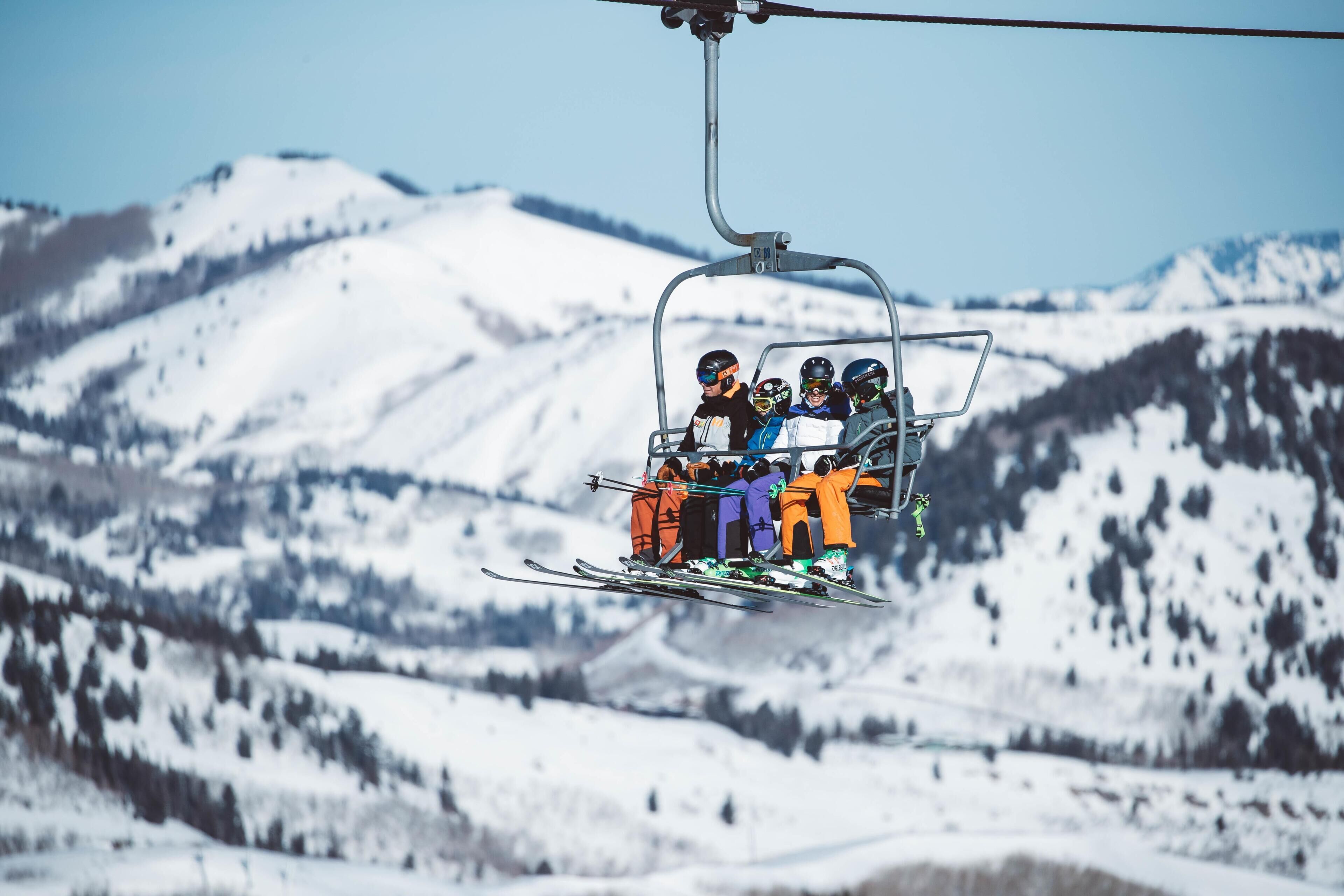 A ski lift with passengers.