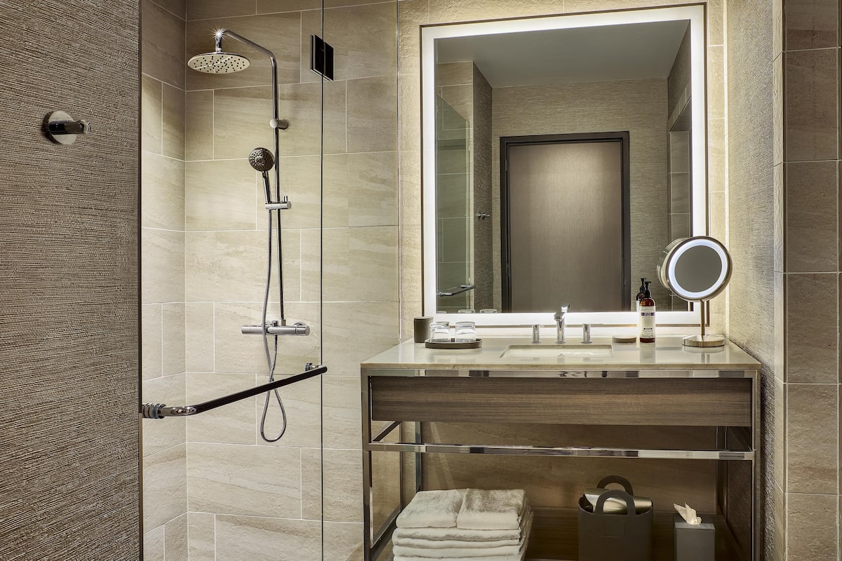 Designer toiletries, hair dryer, bathrobes, slippers