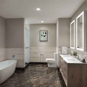 Enjoy a relaxing soak in the bathtub and unwind in the stylish bathroom.