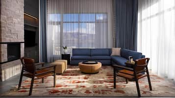 A modern living room with a sectional sofa, a fireplace, and a large window with curtains.