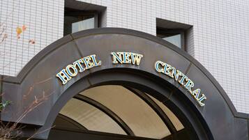 A hotel entrance sign with the name "HOTEL NEW CENTRAL".