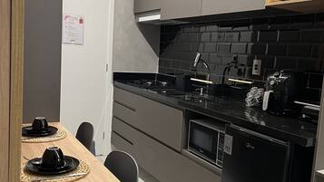 Fridge, microwave, stovetop, coffee/tea maker