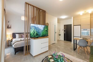 Junior Apartment | Living area | Flat-screen TV