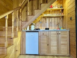 Mini-fridge, stovetop, highchair, cookware/dishes/utensils