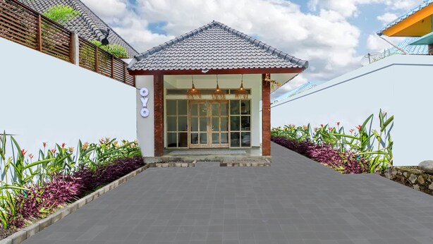 A building with a tiled roof, a glass door entrance, and a sign that reads "OYO". - OYO 2896 Uma Menuh Guest House Near Pantai Keramas (Perean Tengah)