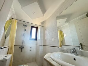 Shower, towels, soap, toilet paper