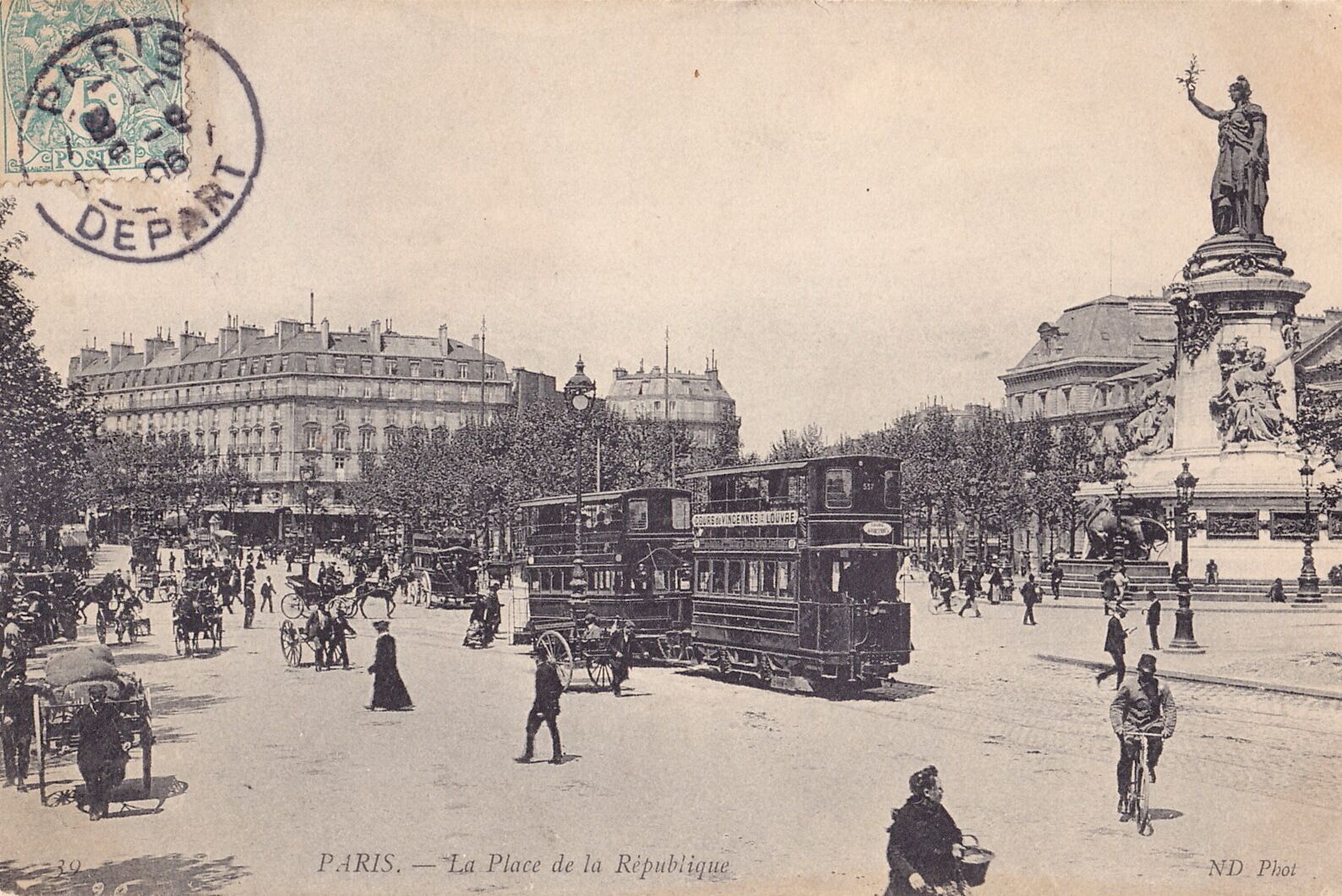 A historical Parisian street scene with horse-drawn carriages, a double-decker bus, and a statue.