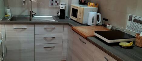 Fridge, microwave, stovetop, coffee/tea maker