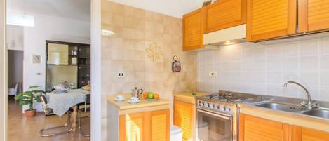 Family House, Multiple Bedrooms (Villetta Tamari 300 meters from the) | Private kitchen | Fridge, microwave, oven, stovetop