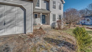 A two-story house with a garage, a front porch, and a small front yard. - 11 Mi to Camelback Resort: Tobyhanna Home! (Tobyhanna)