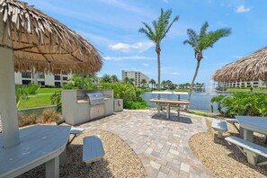 Outdoor dining - Modern Condo! Beach Access, Shared Pools, and Activities! Gulf and Bay Club D409 (Siesta Key)