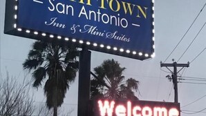 A sign for Southtown Inn & Suites in San Antonio, featuring a 'Welcome' message. - SouthTown SA Inn (San Antonio)