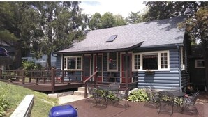 A log cabin with a porch, outdoor seating, and a small deck. - 2 Bed /2 bath cabin w/ Lake George access (Lake George)