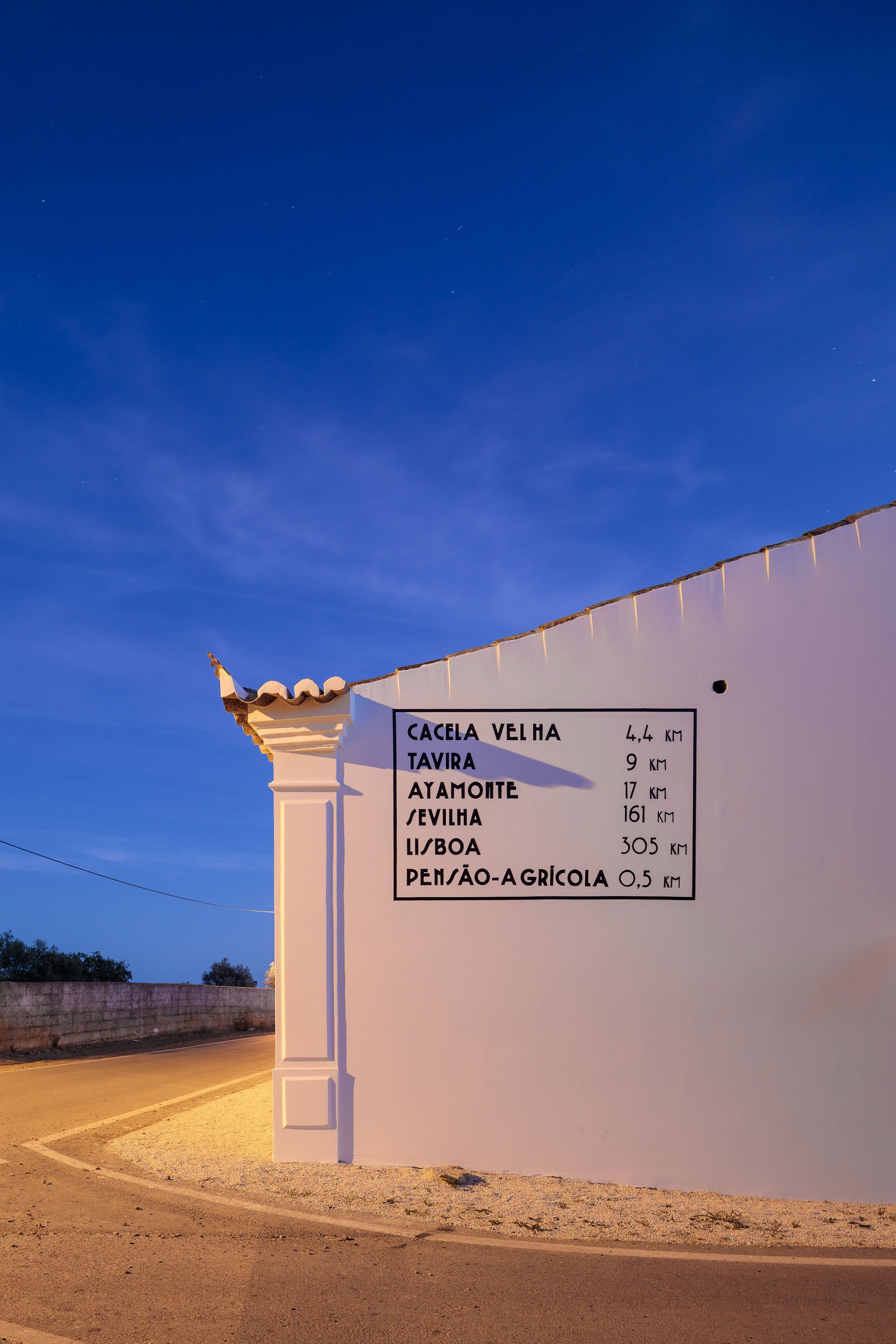 A sign with distances to various locations.