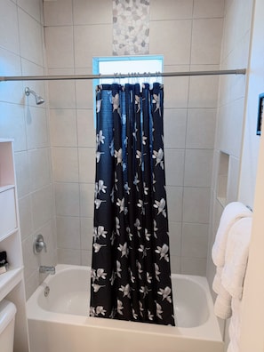 Shower, hair dryer, towels, soap