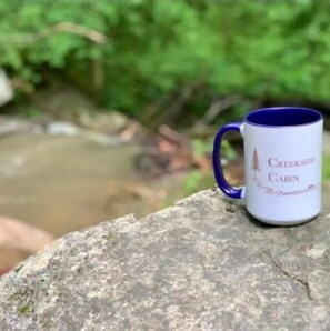 Situated near a serene stream, this cabin offers a peaceful retreat.