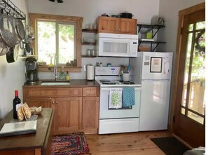 Fridge, microwave, cookware/dishes/utensils