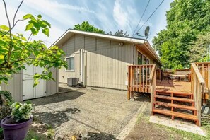 A single-story building with a covered patio area and a small deck. - Bruneau Bungalow Side A (Kennewick)