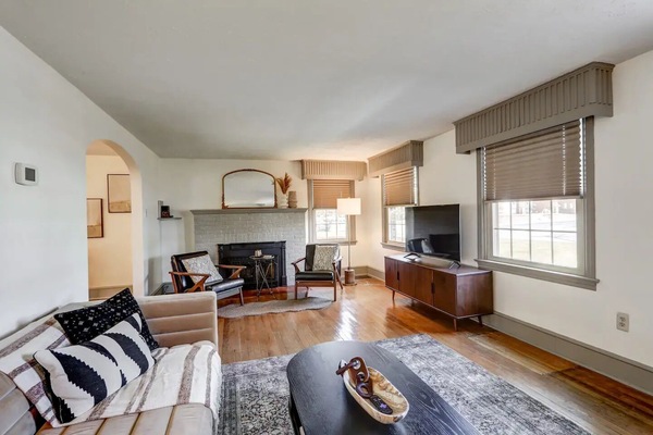 Front living room with fireplace, TV, and cozy seating area