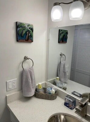 Shower, hair dryer, towels, toilet paper