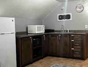 Fridge, microwave, stovetop, coffee/tea maker