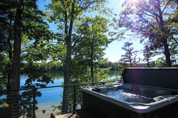 Outdoor spa tub - 3 Sandy Beachfront Cabins & Hot Tub on Beautiful Spider Lake - Betty's Hideout (Traverse City)