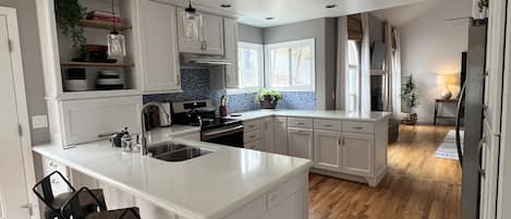 Coffee/tea maker, fridge, microwave, oven