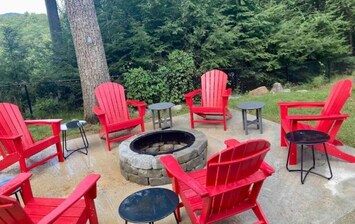 Newly constructed fire pit area with plenty of seating right in front of jacuzzi