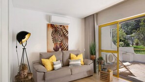 A modern living room with a sofa, decorative pillows, a floor lamp, a wall-mounted air conditioner, and a large window with a view of the outdoors.