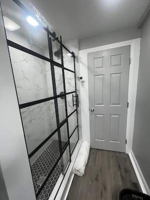 Shower, hair dryer, towels, soap