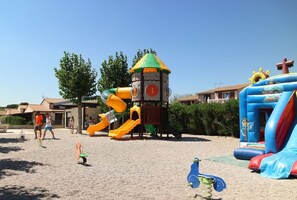 A playground with slides and a climbing structure. - Spacious corner Villa located in the secured residence of "Les Portes du Soleil, for 7 people,... (PORTIRAGNES)