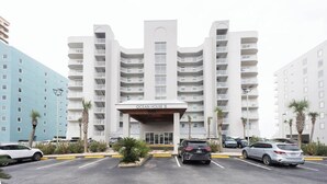 A multi-story hotel with a prominent entrance labeled "Ocean House II."