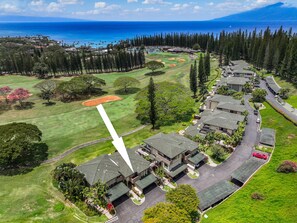 Aerial view of Kapalua Golf Villas 15T5 with lush fairways and stunning ocean backdrop.