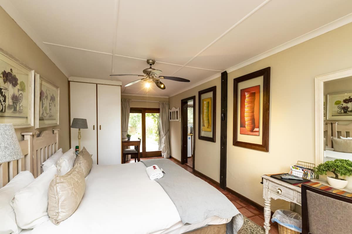 Premium bedding, desk, laptop workspace, iron/ironing board