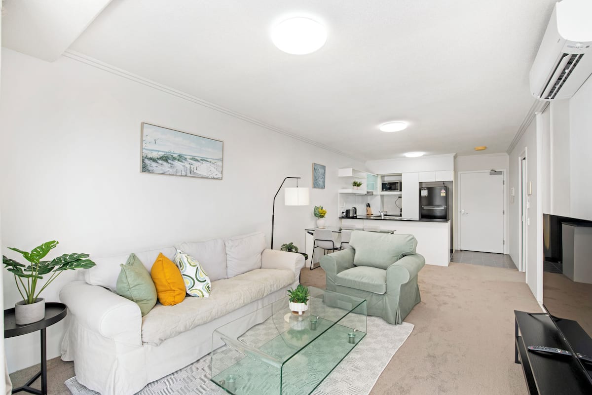 Two-Bedroom Apartment with Balcony and Two Bathrooms | Living area | 50-inch flat-screen TV with cable channels