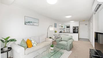 Two-Bedroom Apartment with Balcony and Two Bathrooms | Living area | 50-inch flat-screen TV with cable channels