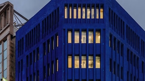 A modern building with a blue facade and multiple windows. - The Blue By Just Inn (Taipei)