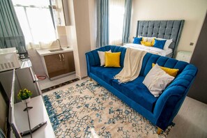 Business Studio | Living area | 24-inch TV with digital channels - Lux Suites Royal Studio Apartments (Nairobi)